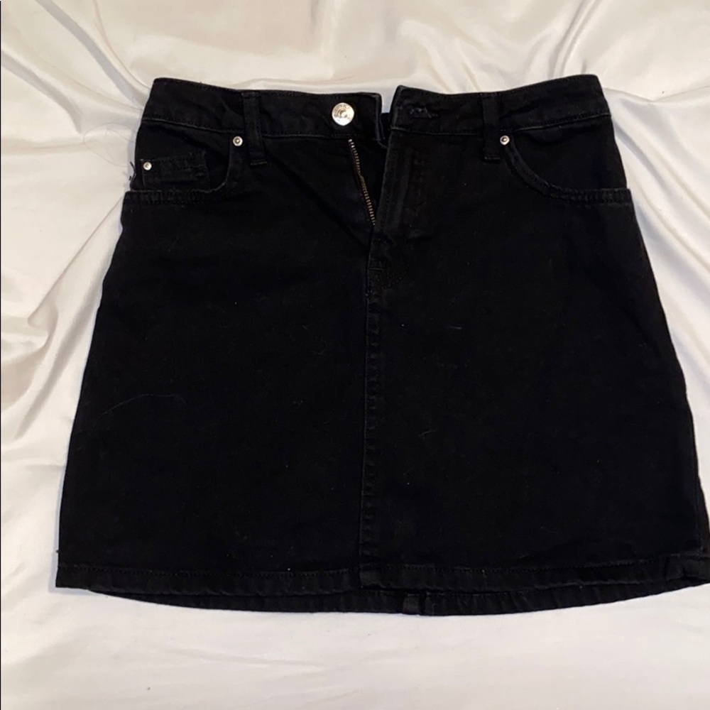 All black denim skirt